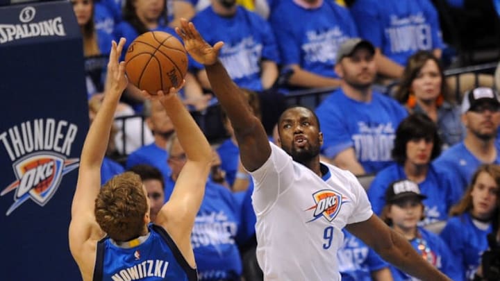 Apr 25, 2016; Oklahoma City, OK, USA; Dallas Mavericks forward Dirk Nowitzki (41) shoots the ball over Oklahoma City Thunder forward Serge Ibaka (9) during the first quarter in game five of the first round of the NBA Playoffs at Chesapeake Energy Arena. Mandatory Credit: Mark D. Smith-USA TODAY Sports