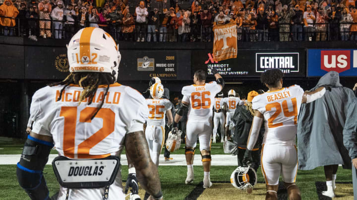 Nov 26, 2022; Nashville, Tennessee, USA; Tennessee Volunteers players and fans celebrate after a 56-0 victory over the Vanderbilt Commodores at FirstBank Stadium. Mandatory Credit: George Walker IV – USA TODAY Sports