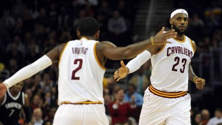 Dec 19, 2014; Cleveland, OH, USA; Cleveland Cavaliers forward LeBron James (23) and Cleveland Cavaliers guard Kyrie Irving (2) celebrate a basket during the second quarter against the Brooklyn Nets at Quicken Loans Arena. Mandatory Credit: Ken Blaze-USA TODAY Sports