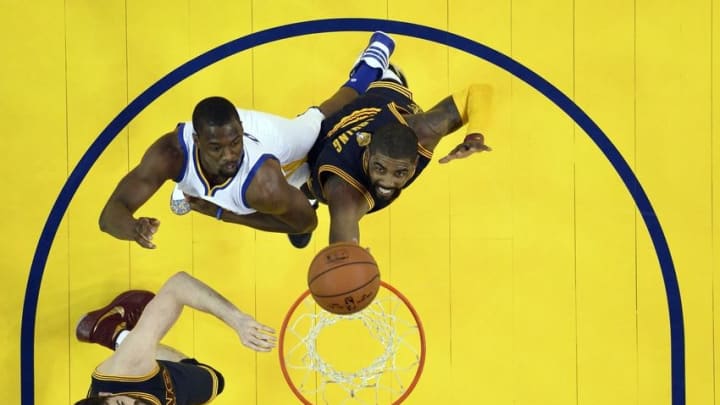 Jun 2, 2016; Oakland, CA, USA; Cleveland Cavaliers guard Kyrie Irving (2) shoots the ball against Golden State Warriors forward Harrison Barnes (40) during the first quarter in game one of the NBA Finals at Oracle Arena. Mandatory Credit: John Mabanglo-Pool Photo via USA TODAY Sports