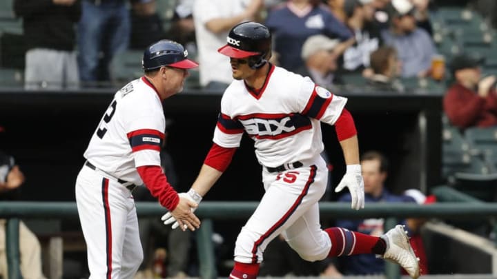 CHICAGO, ILLINOIS - APRIL 07: Third base coach Nick Capra #12 congratulates Adam Engel #15 of the Chicago White Sox after his home run during the seventh inning against the Seattle Mariners at Guaranteed Rate Field on April 07, 2019 in Chicago, Illinois. (Photo by Nuccio DiNuzzo/Getty Images)