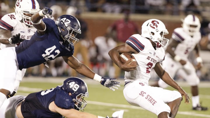 STATESBORO, GA – SEPTEMBER 01: Corey Fields #2 of the South Carolina State Bulldogs looks for running room as he is chased down in the fourth quarter by Traver Vliem #49 and Alvin Ward Jr. #42 of the Georgia Southern Eagles on September 1, 2018 in Statesboro, Georgia. (Photo by Chris Thelen/Getty Images)