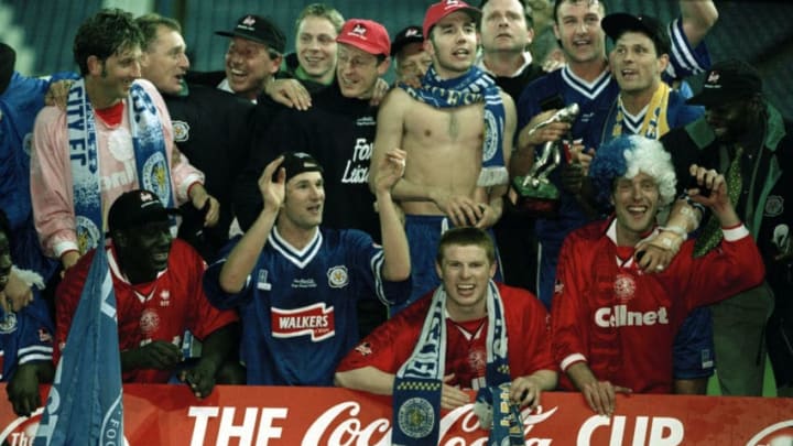 Leicester City celebrate with the trophy after the Coca Cola League Cup Final Replay between Leicester City and Middlesbrough at Hillsborough in Sheffield, 16th April 1997. Leicester City won 1-0 after extra-time. Identified are Neil Lennon (bottom centre, scarf around neck), and Muzzy Izzet (above, without shirt). (Photo by Professional Sport/Popperfoto/Getty Images)