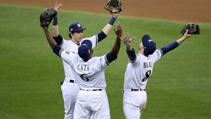 MILWAUKEE, WI - OCTOBER 19: Ryan Braun #8, Lorenzo Cain #6 and Christian Yelich #22 of the Milwaukee Brewers celebrate after defeating the Los Angeles Dodgers in Game Six of the National League Championship Series at Miller Park on October 19, 2018 in Milwaukee, Wisconsin. (Photo by Dylan Buell/Getty Images)
