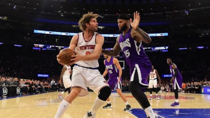 Mar 20, 2016; New York, NY, USA; New York Knicks center Robin Lopez (8) is defended by Sacramento Kings center DeMarcus Cousins (15) during the fourth quarter at Madison Square Garden. The Sacramento Kings defeated the New York Knicks 88-80. Mandatory Credit: Steven Ryan-USA TODAY Sports