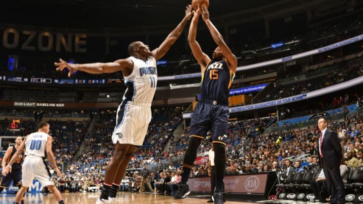 ORLANDO, FL - NOVEMBER 11: Derrick Favors #15 of the Utah Jazz shoots the ball against Bismack Biyombo #11 of the Orlando Magic during a game on November 11, 2016 at the Amway Center in Orlando, Florida. NOTE TO USER: User expressly acknowledges and agrees that, by downloading and or using this photograph, user is consenting to the terms and conditions of the Getty Images License Agreement. Mandatory Copyright Notice: Copyright 2016 NBAE (Photo by Fernando Medina/NBAE via Getty Images)