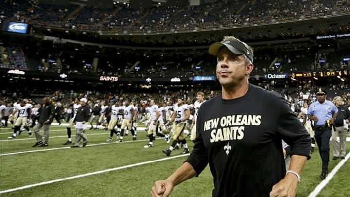 Aug 9, 2013; New Orleans, LA, USA; New Orleans Saints head coach Sean Payton runs to midfield following a win against the Kansas City Chiefs in a preseason game at the Mercedes-Benz Superdome. Mandatory Credit: Derick E. Hingle-USA TODAY Sports