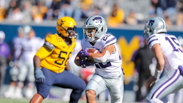 Oct 31, 2020; Morgantown, West Virginia, USA; Kansas State Wildcats running back Deuce Vaughn (22) runs the ball during the second quarter against the West Virginia Mountaineers at Mountaineer Field at Milan Puskar Stadium. Mandatory Credit: Ben Queen-USA TODAY Sports