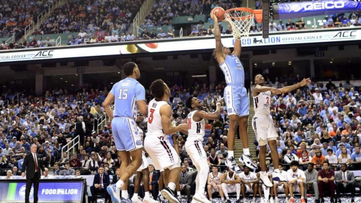 GREENSBORO, NORTH CAROLINA - MARCH 10: Armando Bacot #5 of the North Carolina Tar Heels dunks the ball against Landers Nolley II #2 of the Virginia Tech Hokies during their game in the first round of the 2020 Men's ACC Basketball Tournament at Greensboro Coliseum on March 10, 2020 in Greensboro, North Carolina. (Photo by Jared C. Tilton/Getty Images)