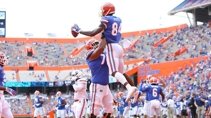 University of Florida Gators tight end Kyle Pits (84) leaps up as he celebrates a touchdown catch with teammates during a game against South Carolina at Ben Hill Griffin Stadium, in Gainesville, Fla. Oct. 3, 2020. [Brad McClenny/The Gainesville Sun]Flgai 100320 Ufvs Scarolina Fb Game12