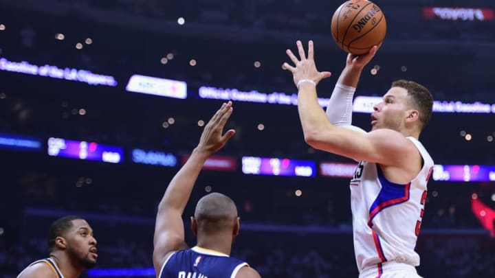 LOS ANGELES, CA - APRIL 15: Blake Griffin #32 of the LA Clippers attempts a shot over Boris Diaw #33 and Derrick Favors #15 of the Utah Jazz during a 97-95 Jazz win during the first half at Staples Center on April 15, 2017 in Los Angeles, California. NOTE TO USER: User expressly acknowledges and agrees that, by downloading and or using this photograph, User is consenting to the terms and conditions of the Getty Images License Agreement. (Photo by Harry How/Getty Images)