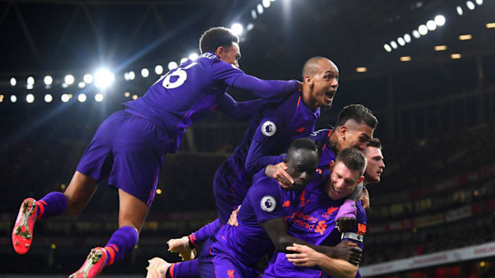 LONDON, ENGLAND - NOVEMBER 03: James Milner of Liverpool celebrates with Sadio Mane, Andy Robertson, Roberto Firmino and Fabinho of Liverpool after he scores his sides first goal during the Premier League match between Arsenal FC and Liverpool FC at Emirates Stadium on November 3, 2018 in London, United Kingdom. (Photo by Michael Regan/Getty Images)