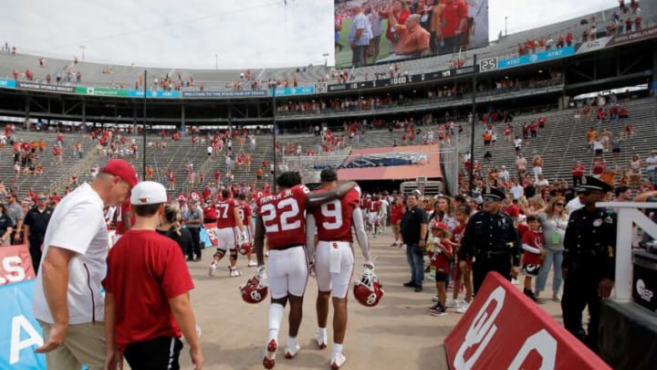 Oklahoma Sooners tight end Brayden Willis (9) and defensive back C.J. Coldon (22) walk off the field after the Red River Showdown college football game between the University of Oklahoma (OU) and Texas at the Cotton Bowl in Dallas, Saturday, Oct. 8, 2022. Texas won 49-0.Lx19135