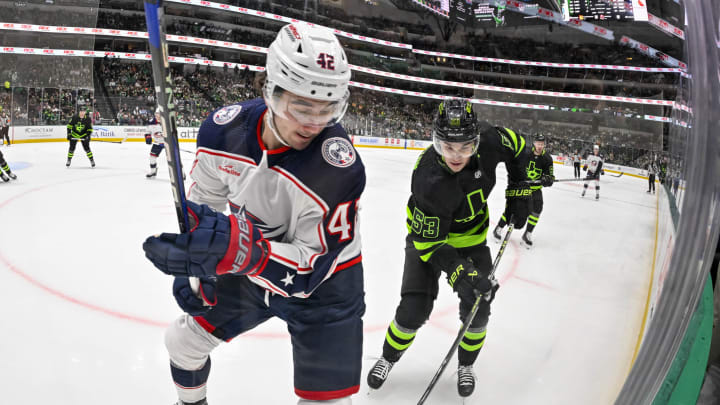 Oct 30, 2023; Dallas, Texas, USA; Columbus Blue Jackets center Alexandre Texier (42) and Dallas Stars center Wyatt Johnston (53) battle for the puck during the second period at the American Airlines Center. Mandatory Credit: Jerome Miron-USA TODAY Sports