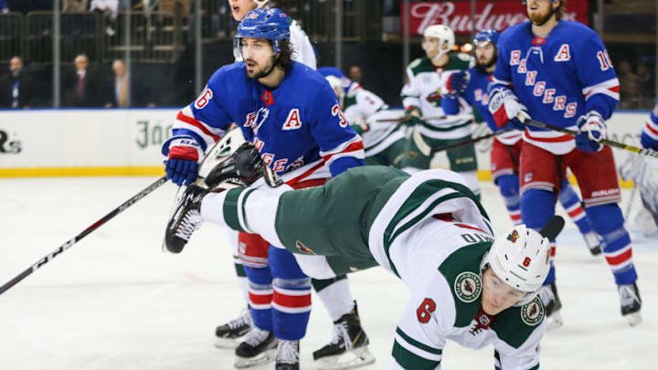 NEW YORK, NY - FEBRUARY 21: New York Rangers Right Wing Mats Zuccarello (36) trips up Minnesota Wild Winger Ryan Donato (6) during the National Hockey League game between the Minnesota Wild and the New York Rangers on February 21, 2019 at Madison Square Garden in New York, NY. (Photo by Joshua Sarner/Icon Sportswire via Getty Images)