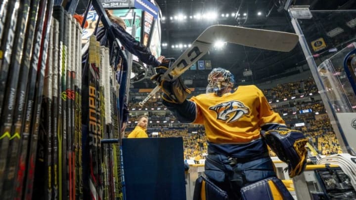 NASHVILLE, TN - APRIL 13: Pekka Rinne #35 of the Nashville Predators taps hands with a young fan prior to Game Two of the Western Conference First Round against the Dallas Stars during the 2019 NHL Stanley Cup Playoffs at Bridgestone Arena on April 13, 2019 in Nashville, Tennessee. (Photo by John Russell/NHLI via Getty Images)