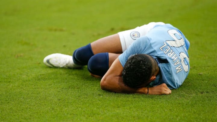 MIAMI, FL - JULY 28: Riyad Mahrez #26 of Manchester City reacts after being injured against Bayern Munich during the first half of the International Champions Cup at Hard Rock Stadium on July 28, 2018 in Miami, Florida. (Photo by Michael Reaves/Getty Images)