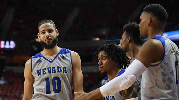 LAS VEGAS, NEVADA - JANUARY 29: Caleb Martin #10 of the Nevada Wolf Pack is congratulated by teammates as the clock expires in their game against the UNLV Rebels at the Thomas & Mack Center on January 29, 2019 in Las Vegas, Nevada. The Wolf Pack defeated the Rebels 87-70. (Photo by Ethan Miller/Getty Images)