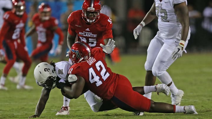 BOCA RATON, FL – SEPTEMBER 16: Larry Brihm Jr. #2 of the Bethune Cookman Wildcats is sacked by William Davis #42 of the Florida Atlantic Owls during second quarter action on September 16, 2017 at FAU Stadium in Boca Raton, Florida. (Photo by Joel Auerbach/Getty Images)