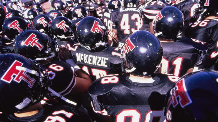 Malcolm McKenzie #17, Wide Receiver for the Texas Tech Red Raiders stands in the middle of the team huddle (Photo by Al Bello/Allsport/Getty Images)