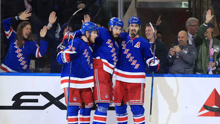 Jun 1, 2022; New York, New York, USA; New York Rangers center Mika Zibanejad (93) celebrates his goal against the Tampa Bay Lightning with left wing Chris Kreider (20) and defenseman Adam Fox (23) in the third period of game one of the Eastern Conference Final of the 2022 Stanley Cup Playoffs at Madison Square Garden. Mandatory Credit: Danny Wild-USA TODAY Sports