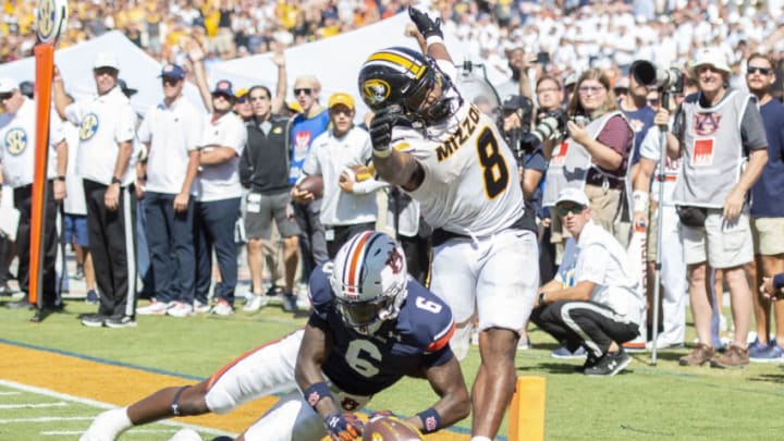 Auburn footballAUBURN, ALABAMA - SEPTEMBER 24: Linebacker Eugene Asante #9 of the Auburn Tigers chases after the loose ball as running back Nathaniel Peat #8 of the Missouri Tigers fumbles during the overtime period at Jordan-Hare Stadium on September 24, 2022 in Auburn, Alabama. (Photo by Michael Chang/Getty Images)