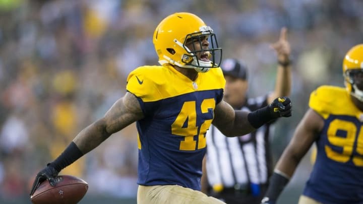 Oct 16, 2016; Green Bay, WI, USA; Green Bay Packers safety Morgan Burnett (42) reacts after intercepting a pass during the third quarter against the Dallas Cowboys at Lambeau Field. The Cowboys won 30-16. Mandatory Credit: Jeff Hanisch-USA TODAY Sports