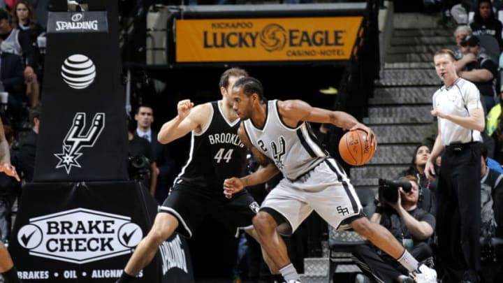 SAN ANTONIO, TX - DECEMBER 10: Kawhi Leonard #2 of the San Antonio Spurs handles the ball during the game against the Brooklyn Nets on December 10, 2016 at the AT&T Center in San Antonio, Texas. NOTE TO USER: User expressly acknowledges and agrees that, by downloading and or using this photograph, user is consenting to the terms and conditions of the Getty Images License Agreement. Mandatory Copyright Notice: Copyright 2016 NBAE (Photos by Chris Covatta/NBAE via Getty Images)