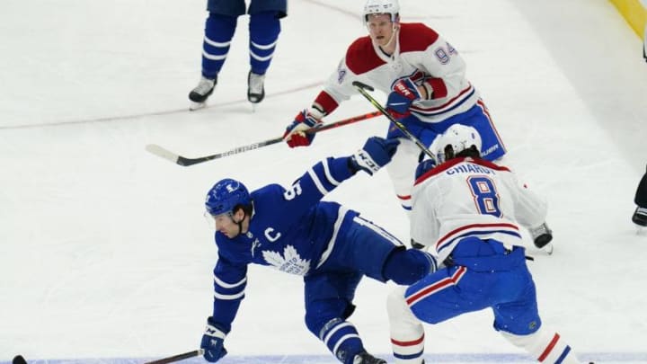 Toronto Maple Leafs forward John Tavares (91) is hit by Montreal Canadiens defenseman Ben Chiarot (8). (John E. Sokolowski-USA TODAY Sports)