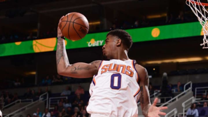 PHOENIX, AZ – JANUARY 31: Marquese Chriss #0 of the Phoenix Suns rebounds the ball during the game against the Dallas Mavericks on January 31, 2018 at Talking Stick Resort Arena in Phoenix, Arizona. NOTE TO USER: User expressly acknowledges and agrees that, by downloading and or using this photograph, user is consenting to the terms and conditions of the Getty Images License Agreement. Mandatory Copyright Notice: Copyright 2018 NBAE (Photo by Michael Gonzales/NBAE via Getty Images)