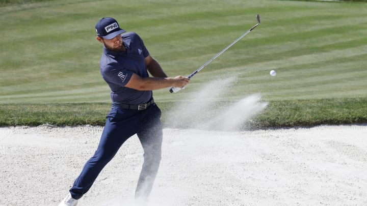 Mar 7, 2021; Orlando, Florida, USA; Tyrrell Hatton hits from the bunker on the sixth green during the final round of the Arnold Palmer Invitational golf tournament at Bay Hill Club & Lodge. Mandatory Credit: Reinhold Matay-USA TODAY Sports