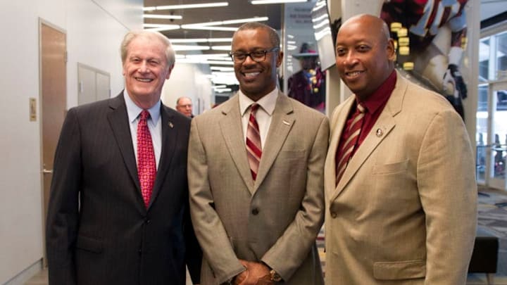TALLAHASSEE FL - DECEMBER 06: Florida State new head coach Willie Taggart poses for a picture with president John Thrasher (left) and athletic director Stan Wilcox (right) with boosters and alumni following the introductory press conference of Florida State's new head coach, Willie Taggart at the Champions Club at Doak Campbell Stadium on December 06, 2017 in Tallahassee, FL. (Photo by Logan Stanford/Icon Sportswire via Getty Images)