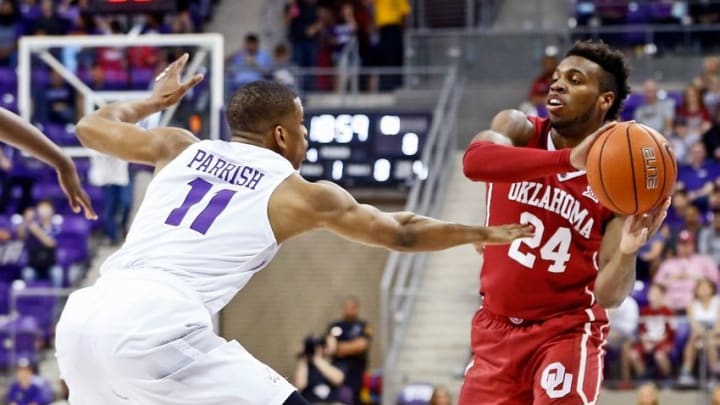 Mar 5, 2016; Fort Worth, TX, USA; Oklahoma Sooners guard Buddy Hield (24) looks to pass as TCU Horned Frogs guard Brandon Parrish (11) defends during the first half at Ed and Rae Schollmaier Arena. Mandatory Credit: Kevin Jairaj-USA TODAY Sports