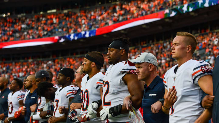 DENVER, CO – AUGUST 18: Chicago Bears players stand with arms locked during the performance of the national anthem before an NFL preseason game against the Denver Broncos at Broncos Stadium at Mile High on August 18, 2018 in Denver, Colorado. (Photo by Dustin Bradford/Getty Images)