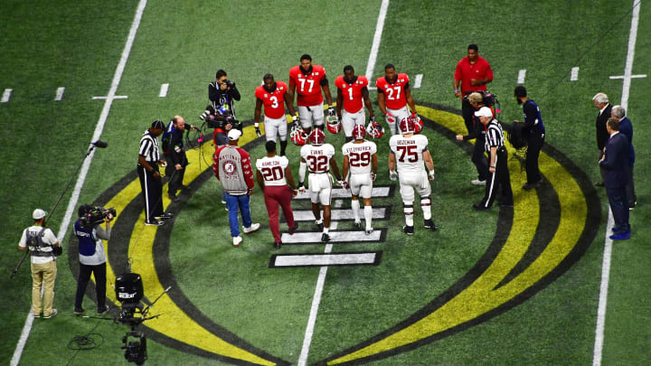 ATLANTA, GA – JANUARY 08: Members of the Alabama Crimson Tide and the Georgia Bulldogs participate in the coin toss before the CFP National Championship presented by AT&T at Mercedes-Benz Stadium on January 8, 2018 in Atlanta, Georgia. (Photo by Scott Cunningham/Getty Images) *** Local Caption ***