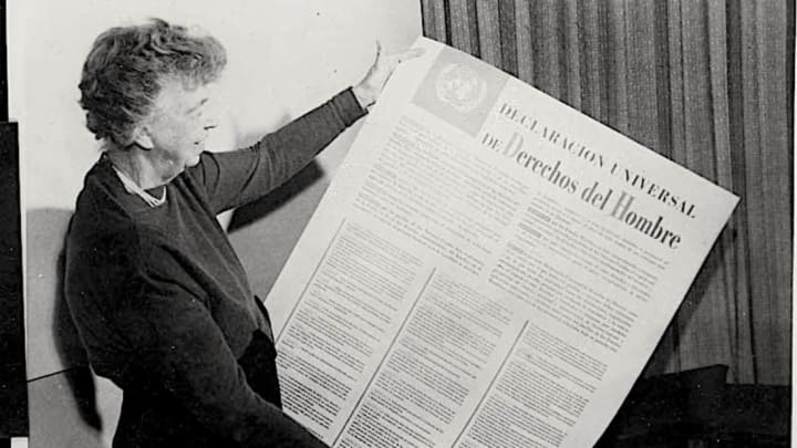 Eleanor Roosevelt holds a Spanish-language version of the UN Declaration of Human Rights.