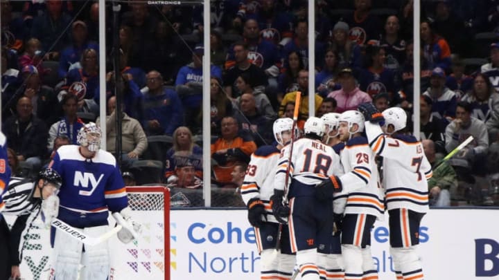 NEW YORK, NEW YORK - OCTOBER 08: James Neal #18 of the Edmonton Oilers scores his hat-trick goal on the power-play at 6:31 of the third period against the New York Islanders at NYCB's LIVE Nassau Coliseum on October 08, 2019 in Uniondale, New York. (Photo by Bruce Bennett/Getty Images)