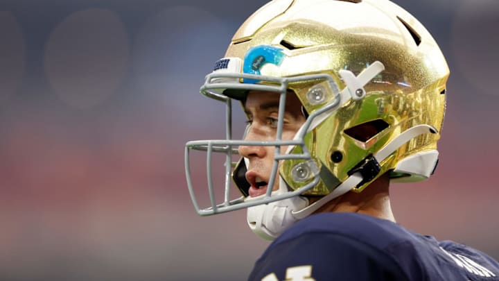 GLENDALE, ARIZONA – JANUARY 01: Jack Coan #17 of the Notre Dame Fighting Irish looks on in the second quarter against the Oklahoma State Cowboys during the PlayStation Fiesta Bowl at State Farm Stadium on January 01, 2022, in Glendale, Arizona. (Photo by Christian Petersen/Getty Images)