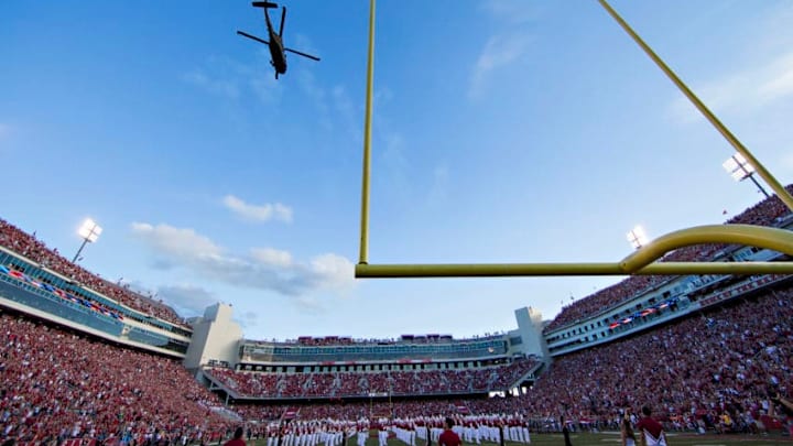 FAYETTEVILLE, AR - SEPTEMBER 17: UH-60 Black Hawk helicopters do a flyover before a game between the Arkansas Razorbacks and the Texas State Bobcats at Razorback Stadium on September 17, 2016 in Fayetteville, Arkansas. The Razorbacks defeated the Bobcats 42-3. (Photo by Wesley Hitt/Getty Images)