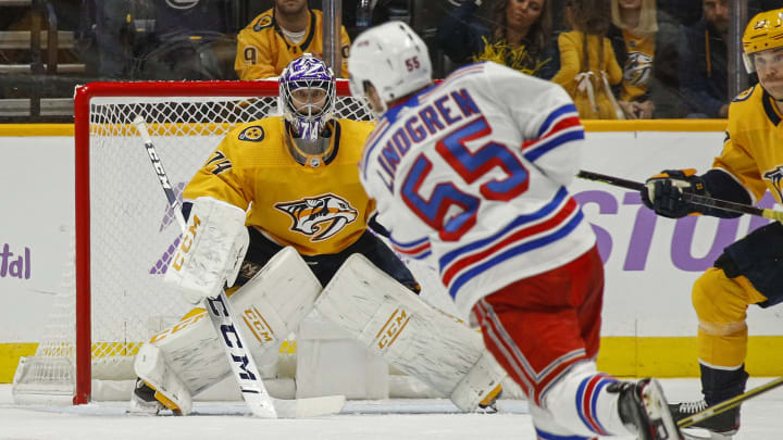 NASHVILLE, TENNESSEE – NOVEMBER 02: Ryan Lindgren #55 of the New York Rangers takes a shot on goalie Juuse Saros #74 of the Nashville Predators during the third period at Bridgestone Arena on November 02, 2019 in Nashville, Tennessee. (Photo by Frederick Breedon/Getty Images)