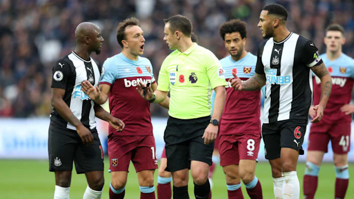 LONDON, ENGLAND - NOVEMBER 02: Mark Noble of West Ham United complains to the referee, Stuart Atwell during the Premier League match between West Ham United and Newcastle United at London Stadium on November 02, 2019 in London, United Kingdom. (Photo by Alex Pantling/Getty Images)