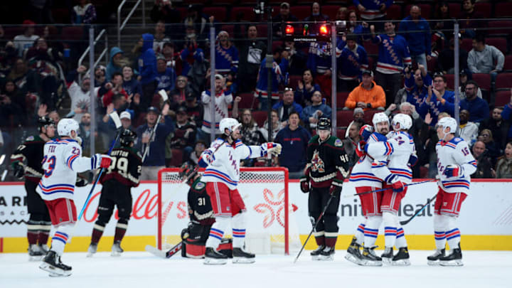Dec 15, 2021; Glendale, Arizona, USA; New York Rangers right wing Kaapo Kakko (24) celebrates a goal against Arizona Coyotes goalie Scott Wedgewood (31) during the third period at Gila River Arena. Mandatory Credit: Joe Camporeale-USA TODAY Sports