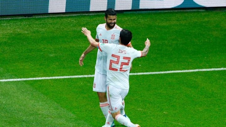 TOPSHOT - Spain's midfielder Isco (R) congratulates Spain's forward Diego Costa for his goal during the Russia 2018 World Cup Group B football match between Iran and Spain at the Kazan Arena in Kazan on June 20, 2018. (Photo by BENJAMIN CREMEL / AFP) / RESTRICTED TO EDITORIAL USE - NO MOBILE PUSH ALERTS/DOWNLOADS (Photo credit should read BENJAMIN CREMEL/AFP/Getty Images)