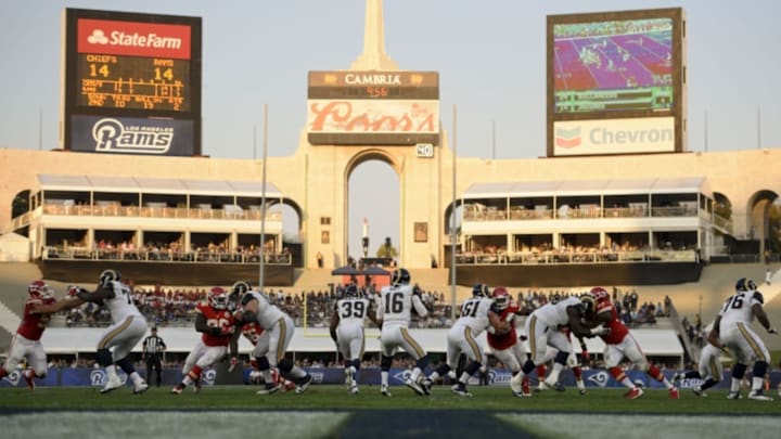 Photo by Vic Stein/Getty Images   Photo by Stephen Dunn/Getty Images