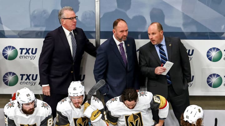 Head coach Peter DeBoer of the Vegas Golden Knights speaks with his staff during the first period against the Dallas Stars in Game Four of the Western Conference Final. (Photo by Bruce Bennett/Getty Images)