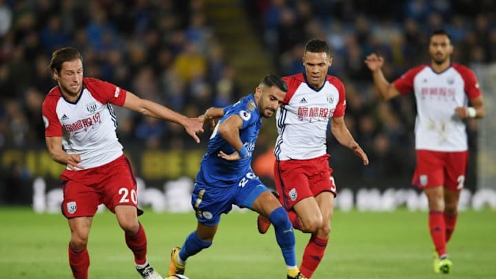 LEICESTER, ENGLAND - OCTOBER 16: Riyad Mahrez of Leicester City is challanged by Grzegorz Krychowiak and Kieran Gibbs of West Bromwich Albion during the Premier League match between Leicester City and West Bromwich Albion at The King Power Stadium on October 16, 2017 in Leicester, England. (Photo by Ross Kinnaird/Getty Images)