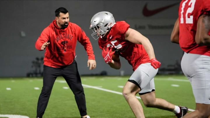 Ohio State Buckeyes tight end Bennett Christian (85) runs past head coach Ryan Day during a spring football practice at the Woody Hayes Athletics Center in Columbus on March 22, 2022.Ncaa Football Ohio State Spring Practice Ohio State Buckeyes tight end Bennett Christian (85) runs past head coach Ryan Day during a spring football practice at the Woody Hayes Athletics Center in Columbus on March 22, 2022.Ncaa Football Ohio State Spring Practice