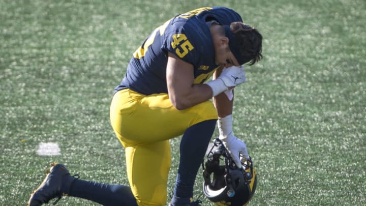 ANN ARBOR, MI - OCTOBER 31: Adam Shibley #45 of the Michigan Wolverines takes a knee after the Michigan Wolverines lost to the Michigan State Spartans at Michigan Stadium on October 31, 2020 in Ann Arbor, Michigan. (Photo by Nic Antaya/Getty Images)
