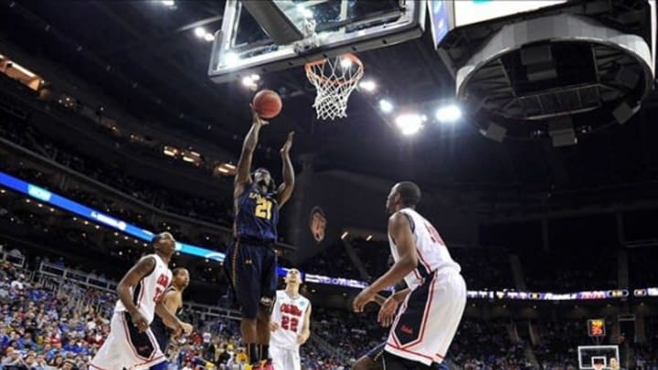 Mar 24, 2013; Kansas City, MO, USA; La Salle Explorers guard Tyrone Garland (21) drives in for a basket against the Mississippi Rebles in the first half during the third round of the NCAA basketball tournament at the Sprint Center. Mandatory Credit: Peter G. Aiken-USA TODAY Sports
