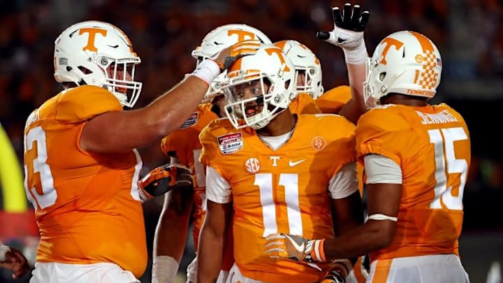 Sep 10, 2016; Bristol, TN, USA; Tennessee Volunteers quarterback Joshua Dobbs (11) celebrates scoring a touchdown against the Virginia Tech Hokies during the second quarter at Bristol Motor Speedway. Mandatory Credit: Peter Casey-USA TODAY Sports